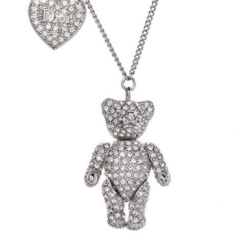 Aged silver necklace, “Dior” teddy bear .